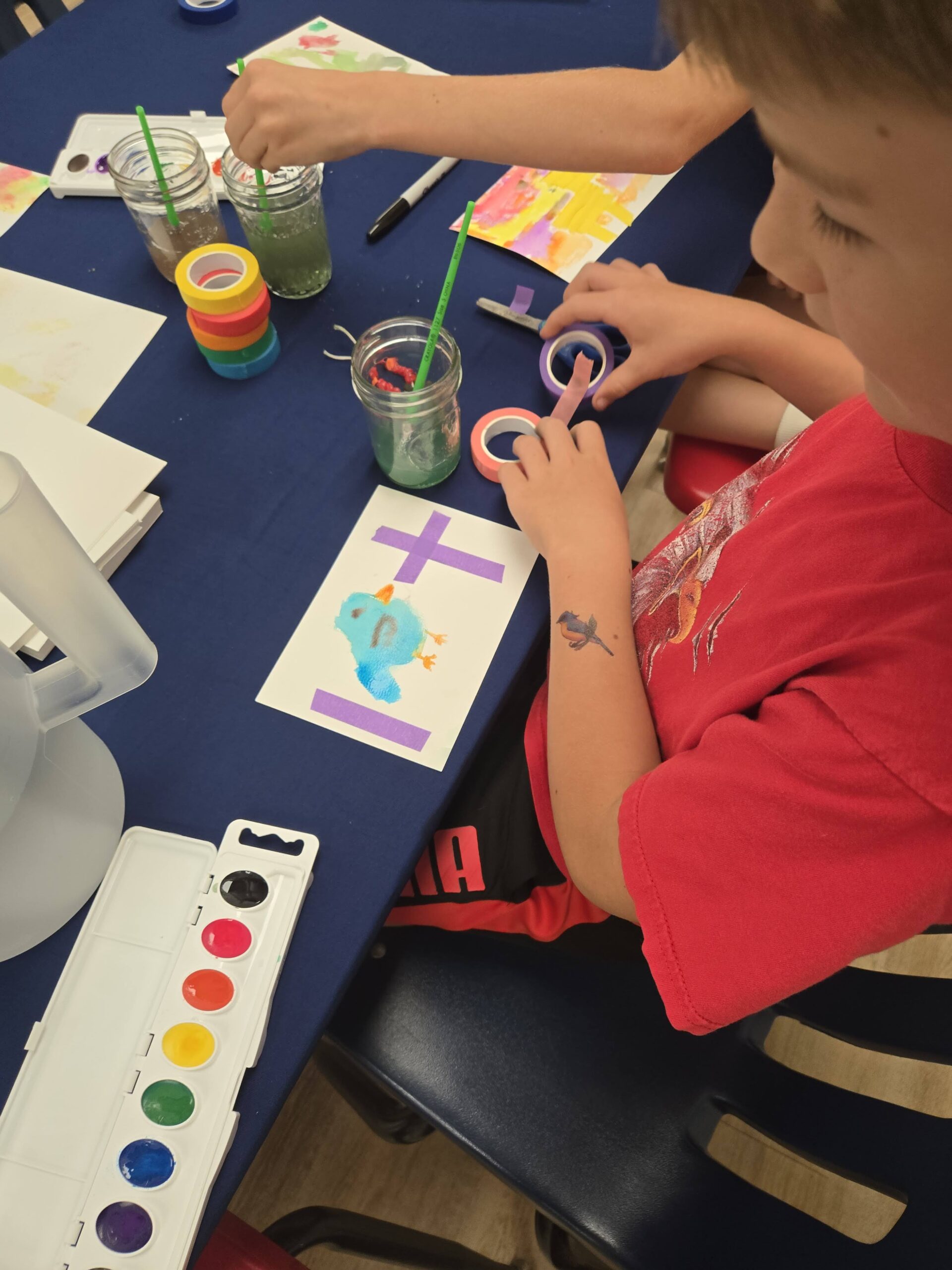 A child crafts a Christian art project.